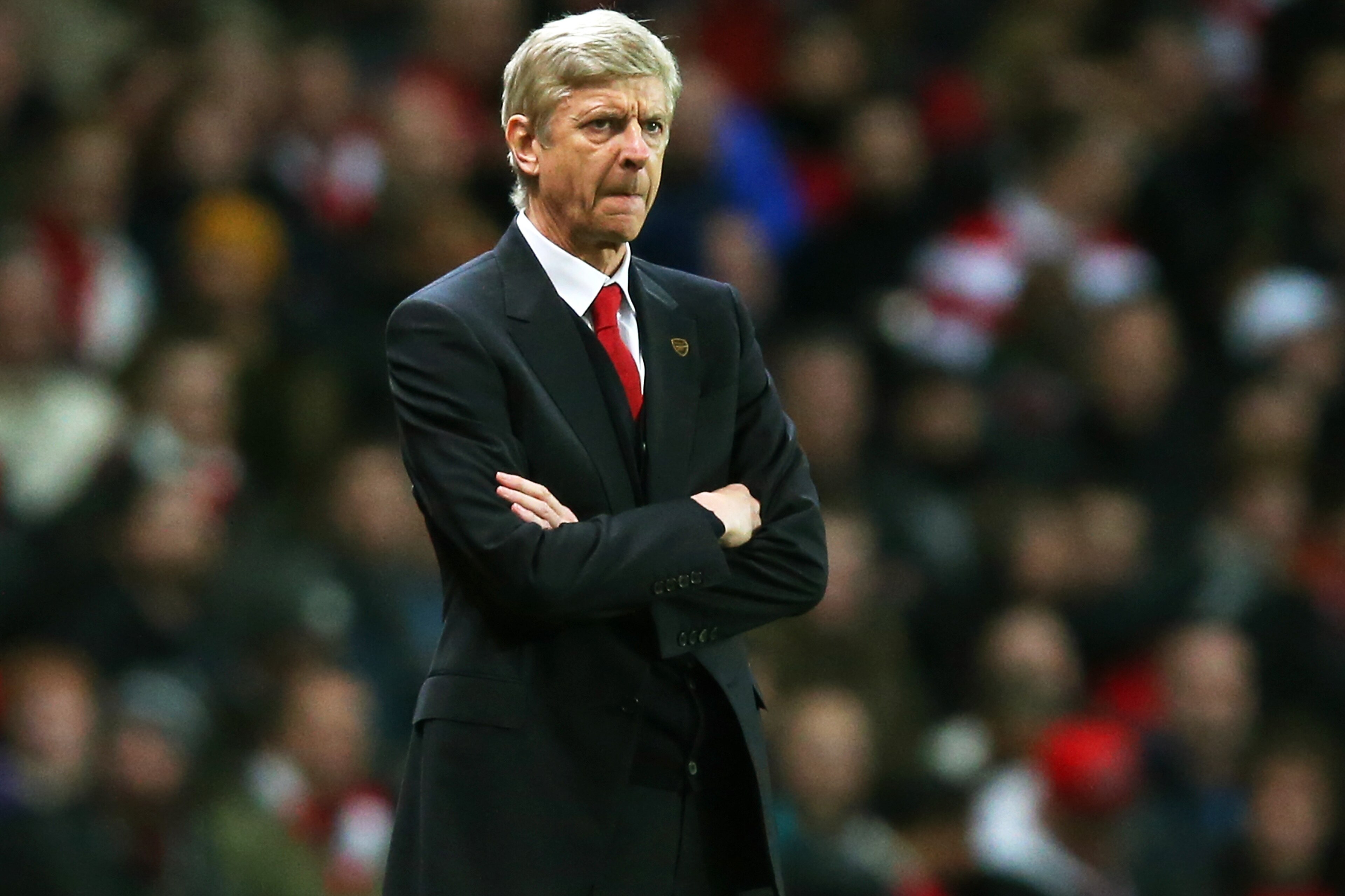 LONDON, ENGLAND - JANUARY 04: Arsene Wenger the Arsenal manager looks on during the Budweiser FA Cup match between Arsenal and Tottenham Hotspur at Emirates Stadium on January 4, 2014 in London, England. (Photo by Clive Rose/Getty Images) LONDON, ENGLAND - JANUARY 04: Arsene Wenger the Arsenal manager looks on during the Budweiser FA Cup match between Arsenal and Tottenham Hotspur at Emirates Stadium on January 4, 2014 in London, England. (Photo by Clive Rose/Getty Images)