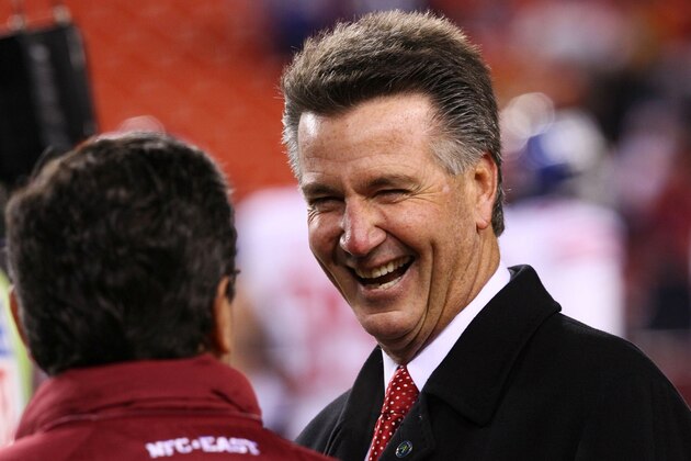 LANDOVER, MD - DECEMBER 21:  (R-L) Bruce Allen, the new general manager of the Washington Redskins, talks with owner Daniel Snyder on the field before the game against the New York Giants at FedEx Field on December 21, 2009 in Landover, Maryland. Allen replaces Vinny Cerrato, who resigned last week. (Photo by Win McNamee/Getty Images)