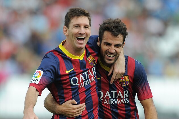 ALMERIA, SPAIN - SEPTEMBER 28:  Lionel Messi (L) celebrates with Cesc Fabregas after scoring FC Barcelona's opening goal during the La Liga match between UD Almeria and FC Barcelona on September 28, 2013 in Almeria, Spain.  (Photo by Denis Doyle/Getty Images)