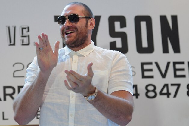 LONDON, ENGLAND - JULY 11:  British heavyweight boxer Tyson Fury welcomes David Haye (not pictured) to a press conference to announce their upcoming title fight on July 11, 2013 in London, England.  (Photo by Shaun Botterill/Getty Images)