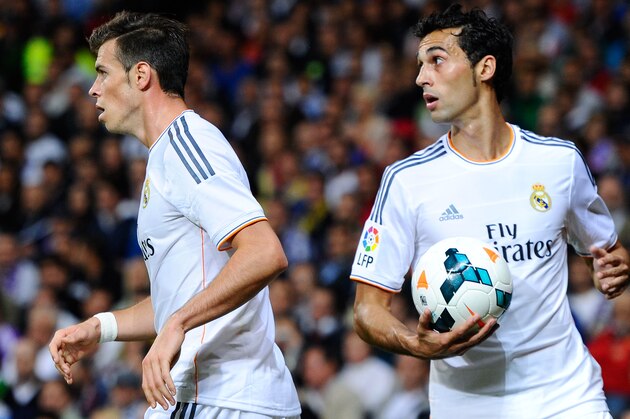 MADRID, SPAIN - SEPTEMBER 28: Gareth Bale  and Alvaro Arbeloa of Real Madrid CF look on during the La Liga match between Real Madrid CF and Club Atletico de Madrid at Bernabeu on September 28, 2013 in Madrid, Spain.  (Photo by David Ramos/Getty Images)