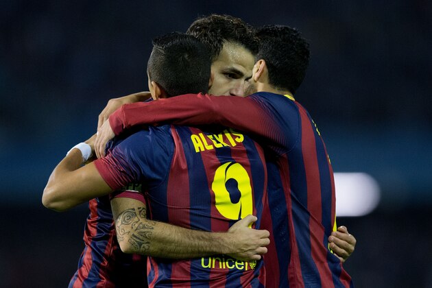 VIGO, SPAIN - OCTOBER 29: Cesc Fabregas (L) of FC Barcelona embraces his teammate Alexis Alejandro Sanchez (2ndL) and Pedro Rodriguez Ledesma (R) celebrating scoring their opening goal during the La Liga match between RC Celta de Vigo and FC Barcelona at Estadio Balaidos on October 29, 2013 in Vigo, Spain.  (Photo by Gonzalo Arroyo Moreno/Getty Images)