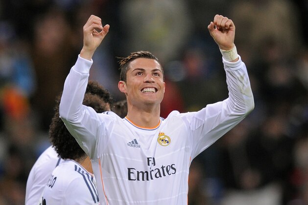 MADRID, SPAIN - JANUARY 06:  Cristiano Ronaldo of Real Madrid CF celebrates after scoring their third goal during the La Liga match between Real Madrid CF and RC Celta de Vigo at the Santiago Bernabeu stadium on January 6, 2014 in Madrid, Spain.  (Photo by Denis Doyle/Getty Images)