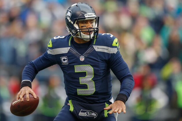 SEATTLE, WA - DECEMBER 29:  Quarterback Russell Wilson #3 of the Seattle Seahawks looks downfield to pass against the St. Louis Rams at CenturyLink Field on December 29, 2013 in Seattle, Washington.  (Photo by Otto Greule Jr/Getty Images)