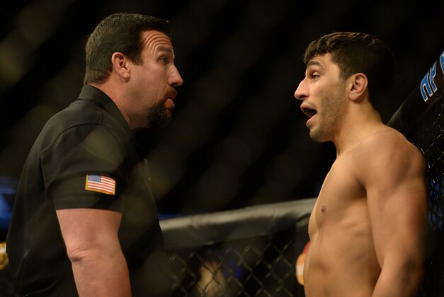 Apr 20, 2013; San Jose, CA, USA; The referee checks Ramsey Nijem's eye in a fight against Myles Jury (not pictured) during the lightweight bout prelims of the UFC on Fuel TV at HP Pavilion. Mandatory Credit: Kyle Terada-USA TODAY Sports Apr 20, 2013; San Jose, CA, USA; The referee checks Ramsey Nijem's eye in a fight against Myles Jury (not pictured) during the lightweight bout prelims of the UFC on Fuel TV at HP Pavilion. Mandatory Credit: Kyle Terada-USA TODAY Sports