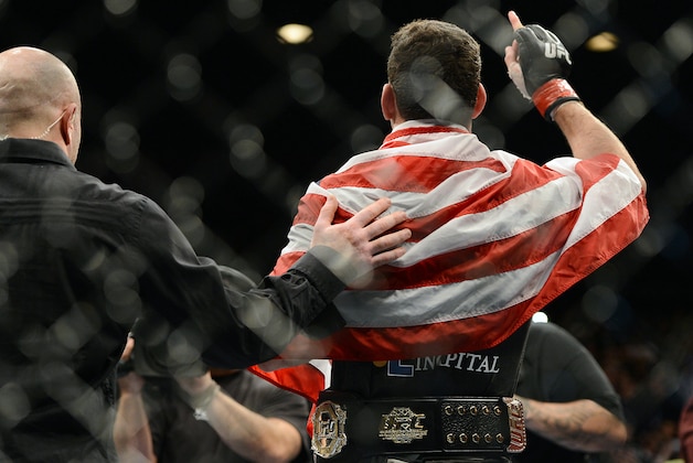 Dec 28, 2013; Las Vegas, NV, USA;    Chris Weidman reacts in the cage after defeating Anderson Silva (not pictured) in their UFC middleweight championship bout at the MGM Grand Garden Arena. Mandatory Credit: Jayne Kamin-Oncea-USA TODAY Sports
