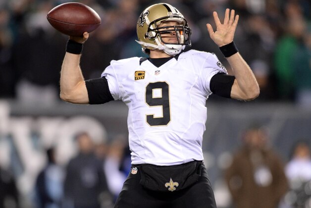 Jan 4, 2014; Philadelphia, PA, USA; New Orleans Saints quarterback Drew Brees (9) throws a pass against the Philadelphia Eagles during the second half of the 2013 NFC wild card playoff football game at Lincoln Financial Field. Mandatory Credit: Joe Camporeale-USA TODAY Sports