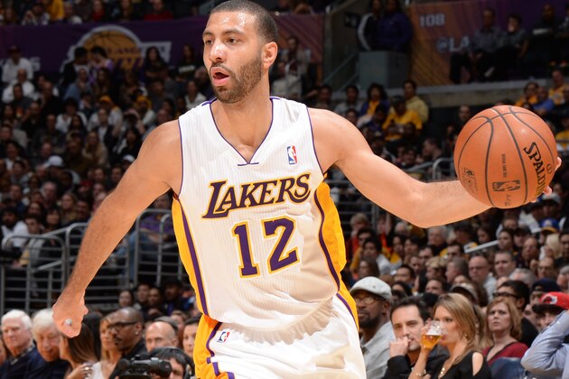 LOS ANGELES, CA - JANUARY 5: Kendall Marshall #12 of the Los Angeles Lakers handles the basketball during a game against the Denver Nuggets at STAPLES Center on January 5, 2014 in Los Angeles, California. NOTE TO USER: User expressly acknowledges and agrees that, by downloading and/or using this Photograph, user is consenting to the terms and conditions of the Getty Images License Agreement. Mandatory Copyright Notice: Copyright 2014 NBAE (Photo by Andrew D. Bernstein/NBAE via Getty Images)