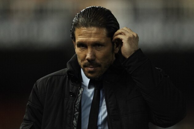 VALENCIA, SPAIN - JANUARY 07:  Head coach of Atletico de Madrid Diego Pablo Simeone looks on prior to the start the Copa del Rey round of 16 first leg match between Valencia CF and Atletico de Madrid at Estadio Mestalla on January 07, 2014 in Valencia, Spain.  (Photo by Manuel Queimadelos Alonso/Getty Images)