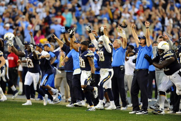 Dec 29, 2013; San Diego, CA, USA; San Diego Chargers players celebrate after a win against the Kansas City Chiefs at Qualcomm Stadium. The Chargers won 27-24 in overtime. Mandatory Credit: Christopher Hanewinckel-USA TODAY Sports