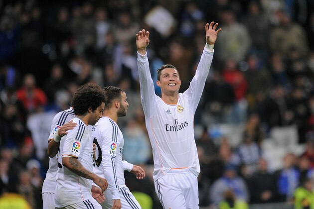 MADRID, SPAIN - JANUARY 06:  Cristiano Ronaldo of Real Madrid CF celebrates after scoring Real's 3rd goal during the La Liga match between Real Madrid CF and RC Celta de Vigo at the Santiago Bernabeu stadium on January 6, 2014 in Madrid, Spain.  (Photo by Denis Doyle/Getty Images)