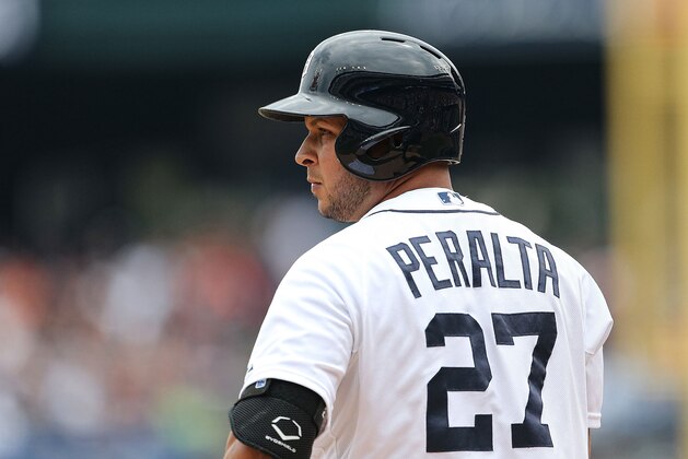 DETROIT, MI - JULY 31:  Jhonny Peralta #27 of the Detroit Tigers checks with the third base coach during the game against the Washington Nationals at Comerica Park on July 31, 2013 in Detroit, Michigan. The Tigers defeated the Nationals 11-1.  (Photo by Leon Halip/Getty Images)