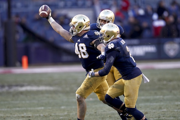 NEW YORK, NY - DECEMBER 28:  Dan Fox #48 of the Notre Dame Fighting Irish celebrates an interception against the Rutgers Scarlet Knights during the New Era Pinstripe Bowl at Yankee Stadium on December 28, 2013 in the Bronx borough of New York City.  (Photo by Jeff Zelevansky/Getty Images)