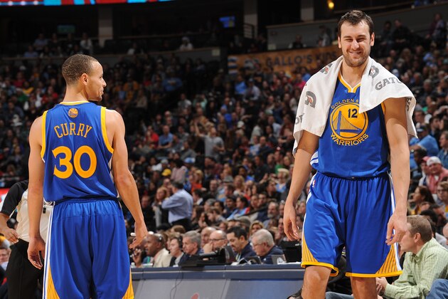 DENVER, CO - December 23: Stephen Curry #30 and Andrew Bogut #12 of the Golden State Warriors share a laugh during the game against the Denver Nuggets on December 23, 2013 at the Pepsi Center in Denver, Colorado. NOTE TO USER: User expressly acknowledges and agrees that, by downloading and/or using this Photograph, user is consenting to the terms and conditions of the Getty Images License Agreement. Mandatory Copyright Notice: Copyright 2013 NBAE (Photo by Bart Young/NBAE via Getty Images)