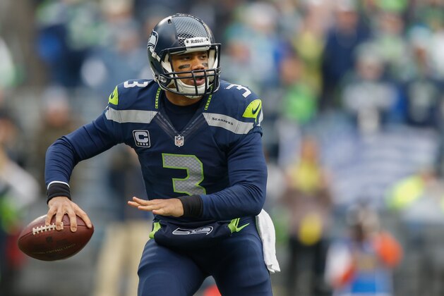 SEATTLE, WA - DECEMBER 29:  Quarterback Russell Wilson #3 of the Seattle Seahawks looks downfield to pass against the St. Louis Rams at CenturyLink Field on December 29, 2013 in Seattle, Washington.  (Photo by Otto Greule Jr/Getty Images)