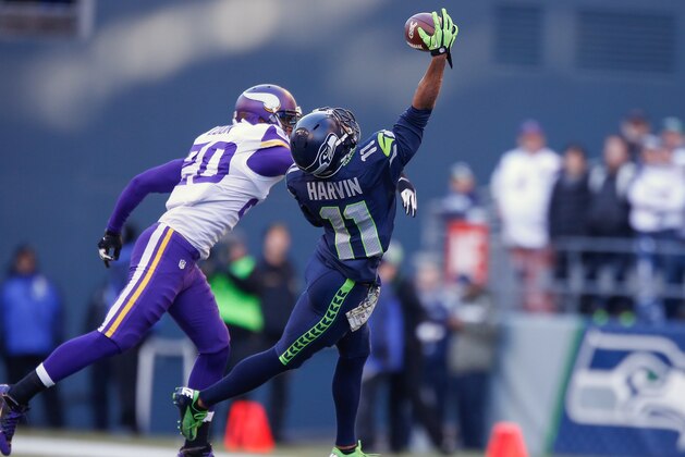 SEATTLE, WA - NOVEMBER 17:  Wide receiver Percy Harvin #11 of the Seattle Seahawks makes a catch against cornerback Chris Cook #20 of the Minnesota Vikings at CenturyLink Field on November 17, 2013 in Seattle, Washington.  (Photo by Otto Greule Jr/Getty Images)