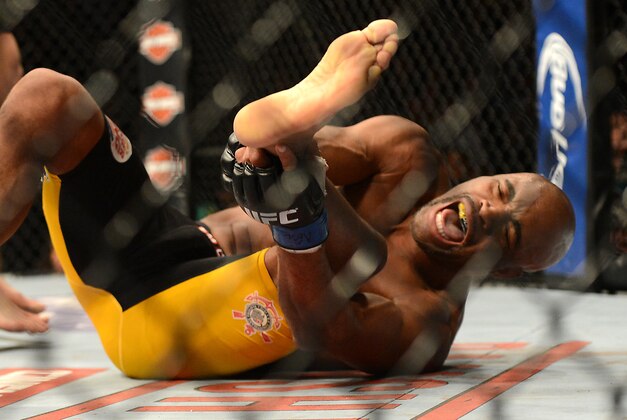 Dec 28, 2013; Las Vegas, NV, USA;    Anderson Silva reacts after breaking his leg on a kick to Chris Weidman (not pictured) during their UFC middleweight championship bout at the MGM Grand Garden Arena. Mandatory Credit: Jayne Kamin-Oncea-USA TODAY Sports