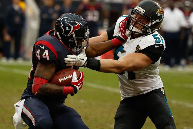 HOUSTON, TX - NOVEMBER 24:  Ben Tate #44 of the Houston Texans fights off the tackle of  Paul Posluszny #51 of the Jacksonville Jaguars in the second half of the game at Reliant Stadium on November 24, 2013 in Houston, Texas.  (Photo by Scott Halleran/Getty Images)