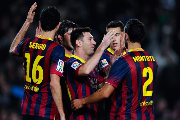 BARCELONA, SPAIN - JANUARY 08:  Lionel Messi of FC Barcelona celebrates with his teammates after scoring his team's third goalduring the Copa del Rey round of 16 first leg match between FC Barcelona and Getafe CF at Camp Nou on January 8, 2014 in Barcelona, Spain.  (Photo by David Ramos/Getty Images)