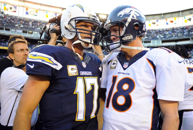 Nov 10, 2013; San Diego, CA, USA; San Diego Chargers quarterback Philip Rivers (17) talks with Denver Broncos quarterback Peyton Manning (18) after a Broncos win at Qualcomm Stadium. The Broncos won 28-20. Mandatory Credit: Christopher Hanewinckel-USA TODAY Sports
