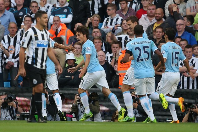 MANCHESTER, ENGLAND - AUGUST 19:  David Silva of Manchester City runs away to celebrate after scoring the first goal past Tim Krul of Newcastle United during the Barclays Premier League match between Manchester City and Newcastle United at the Etihad Stadium on August 19, 2013 in Manchester, England.  (Photo by Clive Brunskill/Getty Images)