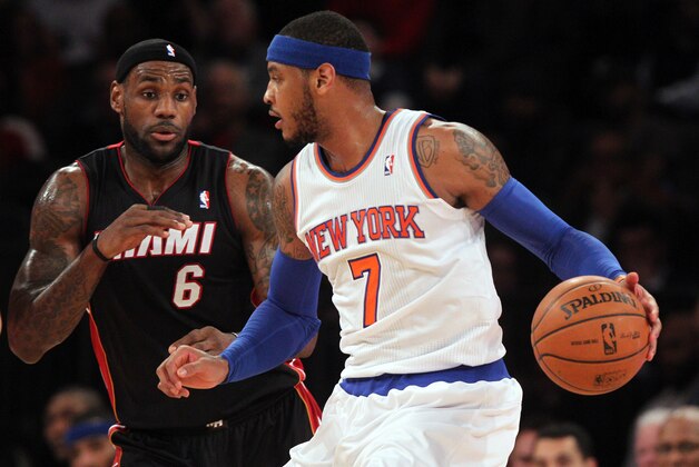Jan 9, 2014; New York, NY, USA; New York Knicks small forward Carmelo Anthony (7) controls the ball against Miami Heat small forward LeBron James (6) during the first quarter of a game at Madison Square Garden. Mandatory Credit: Brad Penner-USA TODAY Sports