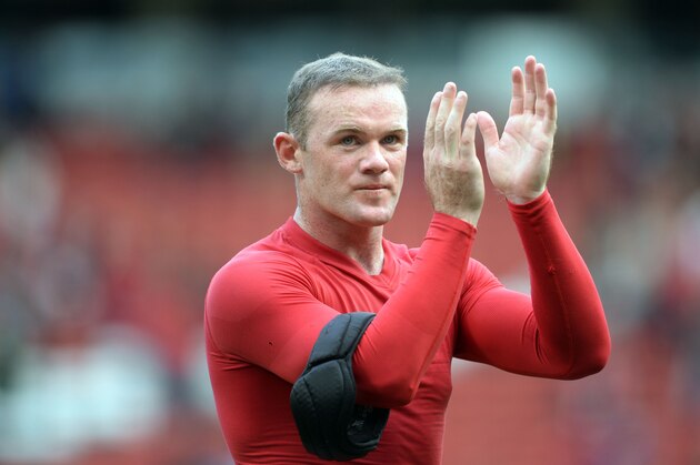 MANCHESTER, ENGLAND - SEPTEMBER 14:  Wayne Rooney of Manchester United applauds the crowd after the Barclays Premier League match between Manchester United and Crystal Palace at Old Trafford on September 14, 2013 in Manchester, England.  (Photo by Michael Regan/Getty Images)