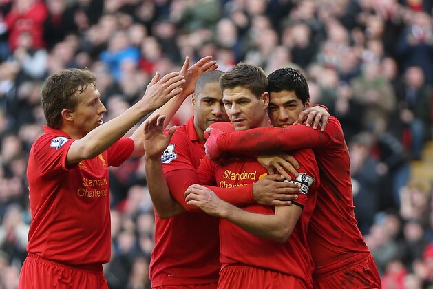 LIVERPOOL, ENGLAND - FEBRUARY 17:  Steven Gerrard of Liverpool celebrates with Luis Suarez,Glen Johnson and Lucas after scoring the first goal from the penalty spot during the Barclays Premier League match between Liverpool and Swansea City at Anfield on February 17, 2013 in Liverpool, England.  (Photo by Clive Brunskill/Getty Images)