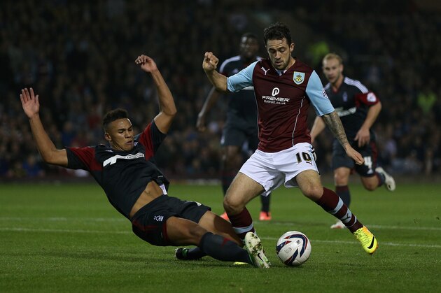 BURNLEY, ENGLAND - SEPTEMBER 24:  Danny Ings of Burnley in action with Jamaal Lascelles of Nottingham Forest during the Capital One Cup Third Round match between Burnley and Nottingham Forest at Turf Moor on September 24, 2013 in Burnley, England.  (Photo by Clive Brunskill/Getty Images)