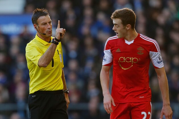 LIVERPOOL, ENGLAND - DECEMBER 29:  Referee Mark Clattenburg speaks to Calum Chambers of Southampton during the Barclays Premier League match between Everton and Southampton at Goodison Park on December 29, 2013 in Liverpool, England.  (Photo by Paul Thomas/Getty Images)