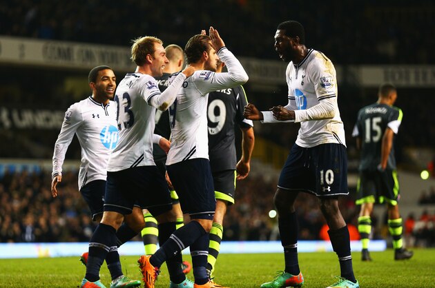 LONDON, ENGLAND - DECEMBER 29:  Roberto Soldado of Tottenham Hotspur is congratulated by team mates including Emmanuel Adebayor (R) and Christian Eriksen after scoring from the penalty spot during the Barclays Premier League match between Tottenham Hotspur and Stoke City at White Hart Lane on December 29, 2013 in London, England.  (Photo by Paul Gilham/Getty Images)