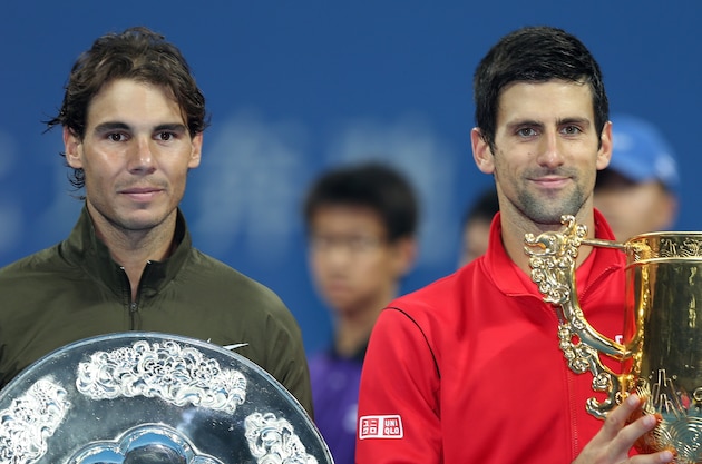 BEIJING, CHINA - OCTOBER 06: Rafael Nadal of Spain and Novak Djokovic of Serbia pose for photographers at the trophy ceremony during the final of the 2013 China Open at the National Tennis Center on October 6, 2013 in Beijing, China.  (Photo by Matthew Stockman/Getty Images)