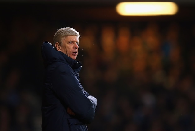 LONDON, ENGLAND - DECEMBER 26:  Arsene Wenger manager of Arsenal looks on during the Barclays Premier League match between West Ham United and Arsenal at Boleyn Ground on December 26, 2013 in London, England.  (Photo by Bryn Lennon/Getty Images)