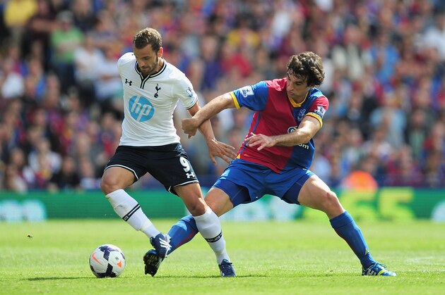 LONDON, ENGLAND - AUGUST 18:  Roberto Soldado of Tottenham Hotspur is tackled by Mile Jedinak of Crystal Palace during the Barclays Premier League match between Crystal Palace and Tottenham Hotspur at Selhurst Park on Augsut 18, 2013 in London, England.  (Photo by Jamie McDonald/Getty Images)