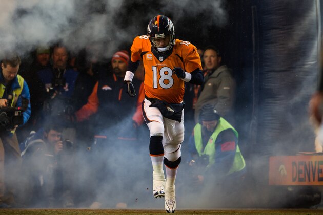 DENVER, CO - DECEMBER 12:  Quarterback Peyton Manning #18 of the Denver Broncos emerges from the tunnel during player introductions before a game against the San Diego Chargers at Sports Authority Field Field at Mile High on December 12, 2013 in Denver, Colorado.  (Photo by Dustin Bradford/Getty Images)