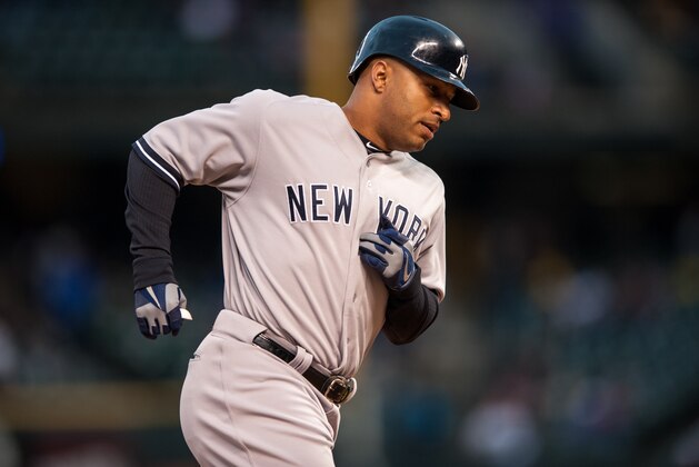 DENVER, CO - MAY 8:  Vernon Wells #12 of the New York Yankees circles the bases after hitting a two-run home run hit in the first inning of a game against the Colorado Rockies at Coors Field on May 8, 2013 in Denver, Colorado. The Yankess led the Rockies 2-0 after one inning. (Photo by Dustin Bradford/Getty Images)