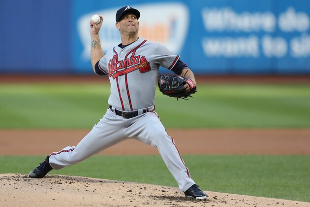 Jul 24, 2013; New York, NY, USA;  Atlanta Braves starting pitcher Tim Hudson (15) pitches during the first inning against the New York Mets at Citi Field Mandatory Credit: Anthony Gruppuso-USA TODAY Sports