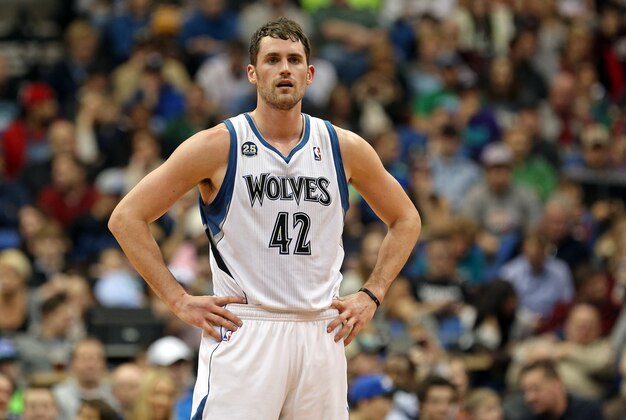 Jan 4, 2014; Minneapolis, MN, USA; Minnesota Timberwolves power forward Kevin Love (42) looks on during a free throw in the first half against the Oklahoma City Thunder at Target Center. Mandatory Credit: Jesse Johnson-USA TODAY Sports