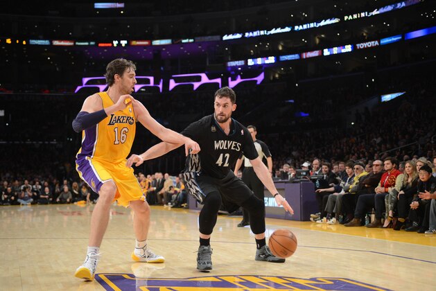 LOS ANGELES, CA - DECEMBER 20: Kevin Love #42 of the Minnesota Timberwolves drives against Pau Gasol #16 of the Los Angeles Lakers at Staples Center on December 20, 2013 in Los Angeles, California. NOTE TO USER: User expressly acknowledges and agrees that, by downloading and/or using this Photograph, user is consenting to the terms and conditions of the Getty Images License Agreement. Mandatory Copyright Notice: Copyright 2013 NBAE (Photo by Noah Graham/NBAE via Getty Images)