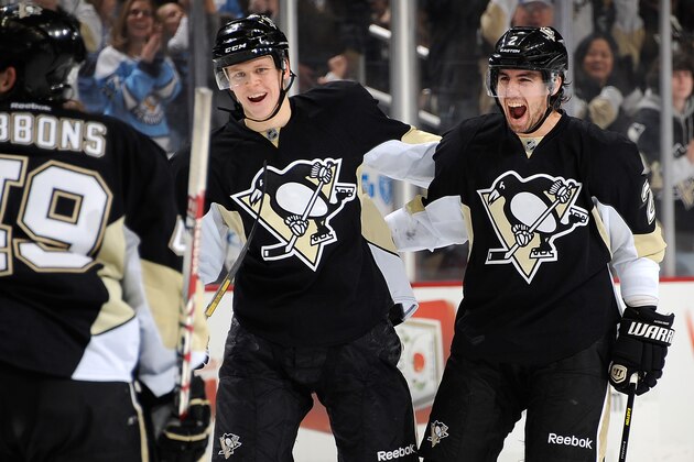 PITTSBURGH, PA - JANUARY 5:  Matt Niskanen #2 of the Pittsburgh Penguins celebrates his game winning goal with Olli Maatta #3 during the third period against the Winnipeg Jets on January 5, 2014 at Consol Energy Center in Pittsburgh, Pennsylvania. Pittsburgh won the game 6-5.  (Photo by Joe Sargent/NHLI via Getty Images)