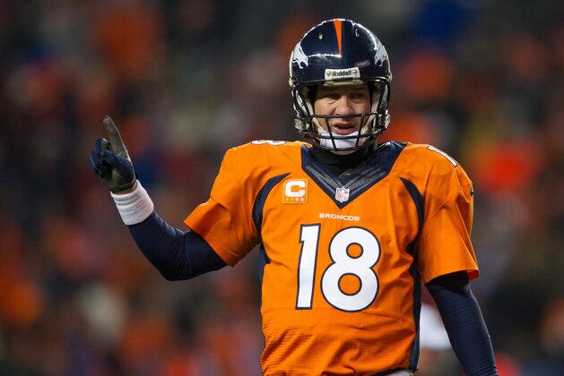 DENVER, CO - DECEMBER 8:  Quarterback Peyton Manning #18 of the Denver Broncos celebrates a 20 yard fourth quarter touchdown pass to Eric Decker #87 (not pictured) during a game against the Tennessee Titans at Sports Authority Field Field at Mile High on December 8, 2013 in Denver, Colorado.  (Photo by Dustin Bradford/Getty Images)