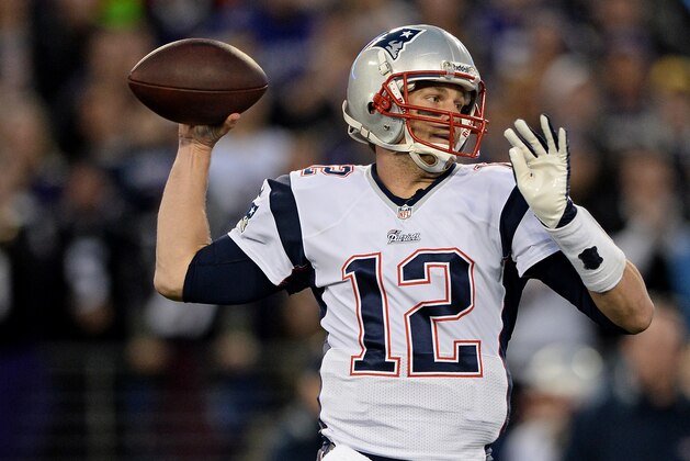 BALTIMORE, MD - DECEMBER 22: Quarterback Tom Brady #12 of the New England Patriots passes against the Baltimore Ravens in the first quarter at M&T Bank Stadium on December 22, 2013 in Baltimore, Maryland. (Photo by Patrick Smith/Getty Images)