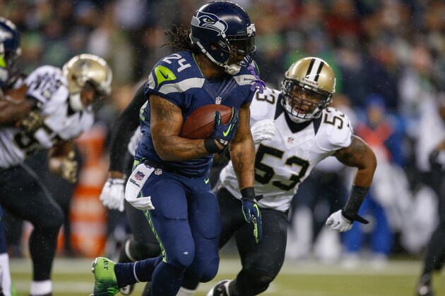 SEATTLE, WA - DECEMBER 02: Running back Marshawn Lynch #24 of the Seattle Seahawks rushes against the New Orleans Saints at CenturyLink Field on December 2, 2013 in Seattle, Washington. (Photo by Otto Greule Jr/Getty Images)