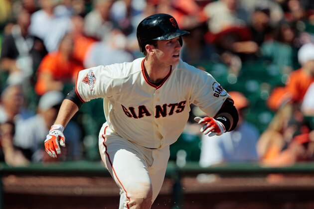 SAN FRANCISCO, CA - SEPTEMBER 8:  Buster Posey #28 of the San Francisco Giants takes off running on a single to right field against the Arizona Diamondbacks in the sixth inning after returning from a finger injury at AT&T Park on September 8, 2013 in San Francisco, California.   The Giants won 3-2 in 11 innings.  (Photo by Brian Bahr/Getty Images)