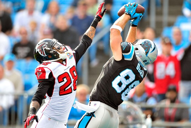 CHARLOTTE, NC - DECEMBER 09: Greg Olsen #88 of the Carolina Panthers makes a touchdown catch against Thomas DeCoud #28 of the Atlanta Falcons during play at Bank of America Stadium on December 9, 2012 in Charlotte, North Carolina. (Photo by Grant Halverson/Getty Images) CHARLOTTE, NC - DECEMBER 09: Greg Olsen #88 of the Carolina Panthers makes a touchdown catch against Thomas DeCoud #28 of the Atlanta Falcons during play at Bank of America Stadium on December 9, 2012 in Charlotte, North Carolina. (Photo by Grant Halverson/Getty Images)
