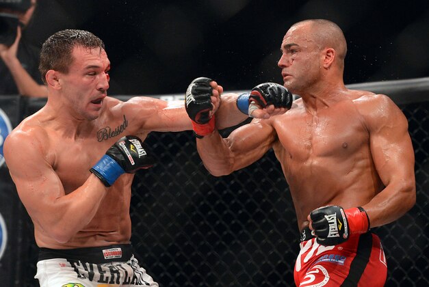 Nov 2, 2013; Long Beach, CA, USA;   Eddie Alvarez (red gloves) and Michael Chandler (blue gloves) during their Bellator lightweight world championship fight at the Long Beach Arena. Alvarez won the fight. Mandatory Credit: Jayne Kamin-Oncea-USA TODAY Sports