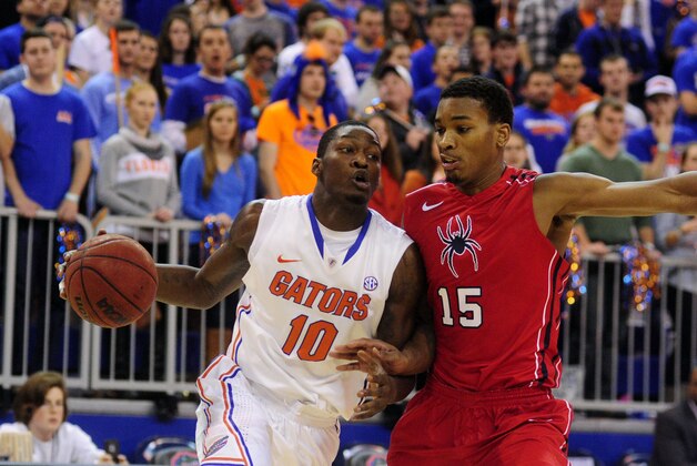 Jan 4, 2014; Gainesville, FL, USA; Florida Gators forward Dorian Finney-Smith (10) works inside against Richmond Spiders forward Terry Allen (15) at Stephen C. O'Connell Center. Mandatory Credit: David Manning-USA TODAY Sports