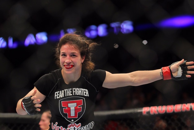 Apr 27, 2013; Newark, NJ, USA; Sara McMann (black shorts)  celebrates defeating Sheila Gaff (not pictured) during UFC 159 at the Prudential Center. Mandatory Credit: Brad Penner-USA TODAY Sports