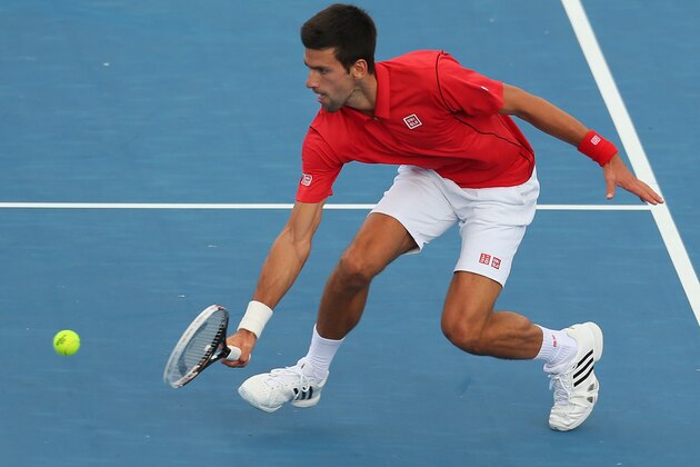 MELBOURNE, AUSTRALIA - JANUARY 09:  Novak Djokovic of Serbia plays a backhand during his match against Juan Monaco of Argentina during day two of the AAMI Classic at Kooyong on January 9, 2014 in Melbourne, Australia.  (Photo by Scott Barbour/Getty Images)