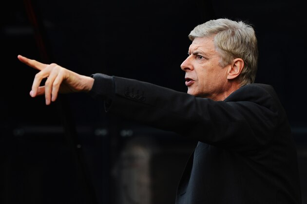 NEWCASTLE UPON TYNE, ENGLAND - DECEMBER 29:  Arsene Wenger, manager of Arsenal makes his point during the Barclays Premier League match between Newcastle United and Arsenal at St James' Park on December 29, 2013 in Newcastle upon Tyne, England.  (Photo by Michael Regan/Getty Images)